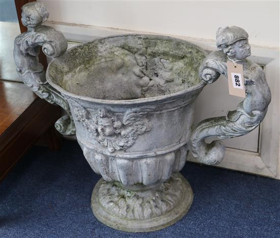 A pair of lead urns W.58cm